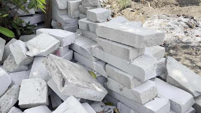 Pile of lightweight concrete bricks on house construction site