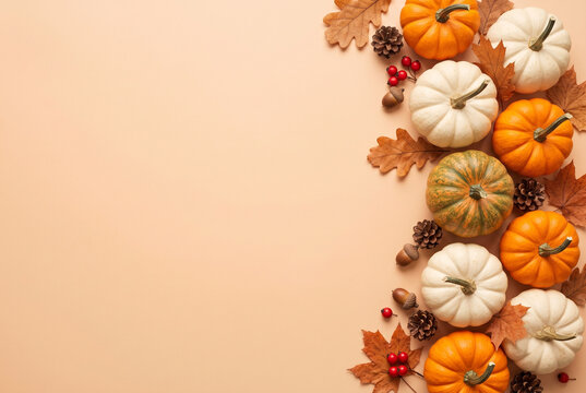 Autumn Pumpkin Flat Lay with White and Orange Pumpkins on Peach Background with Copy Space