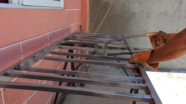 Cutting Metal Bed Frame Section with Manual Hacksaw