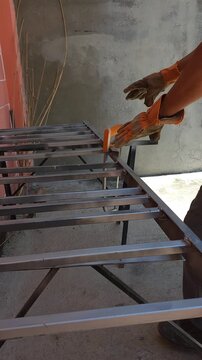 Hacksaw Tool Resting and Balancing on Metal Frame