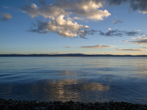Serene lake view with clouds and calm water