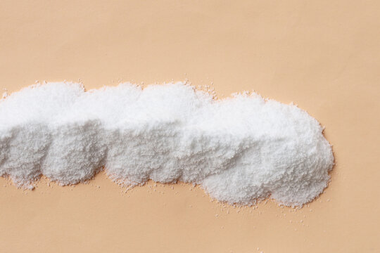 White creatine powder, used as a pre-workout supplement for gym and fitness.