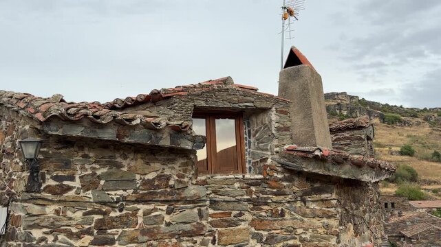 Patones traditional slate stone house facade in patones, spain