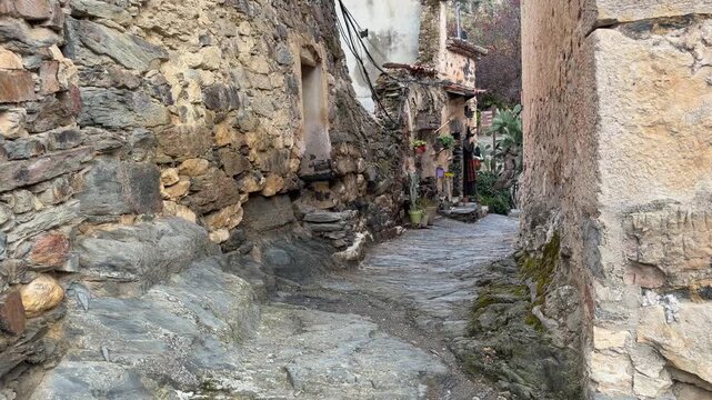 Patones stone alley with a witch mannequin in the rustic village of patones