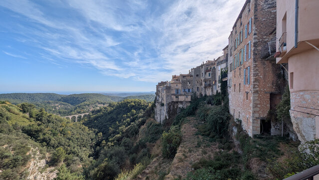 Panoramic view of Tourrettes sur Loup and wooded valley in southern France. 