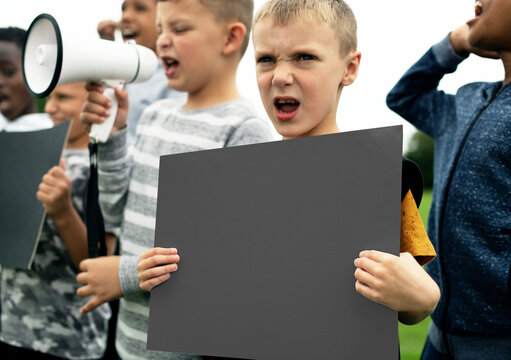 Children protesting with blank signs, suitable as mockup