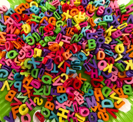 Colorful plastic alphabet letters on the table for craft © romaset