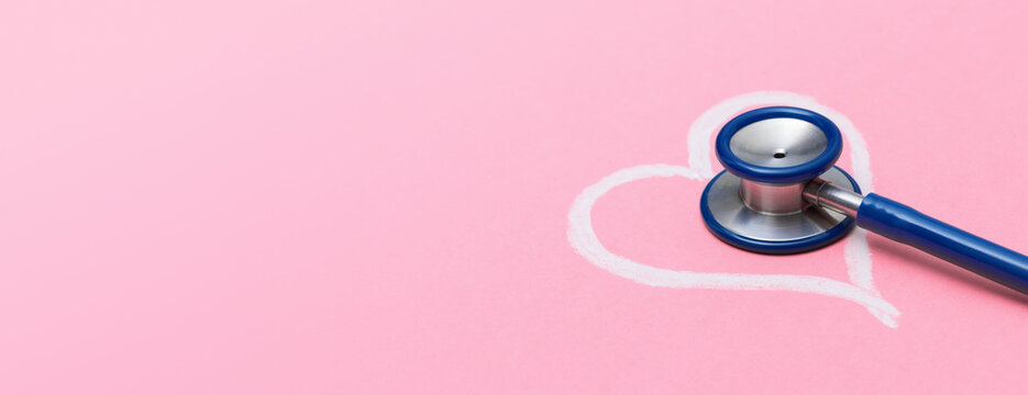 Heart Care Banner with Stethoscope and Chalk Heart Outline on Pink Background