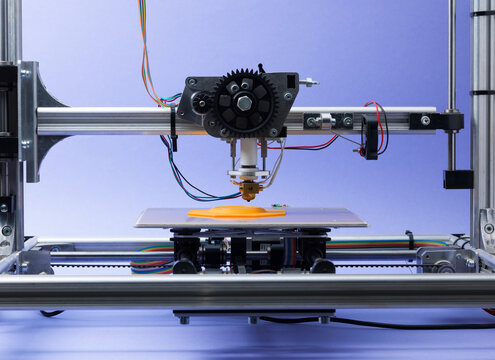 Front View of Desktop 3D Printer Extruding Plastic Filament