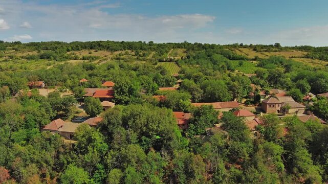 Aerial around view of old rustic vintage houses with wine cellars in Rogljevacke pivnice in Negotin region of Serbia, 4k