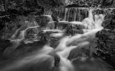 Long exposure of small cascades along the Brühlbach below Urach Waterfall near Bad Urach, captured in dramatic black and white. © ON-Photography