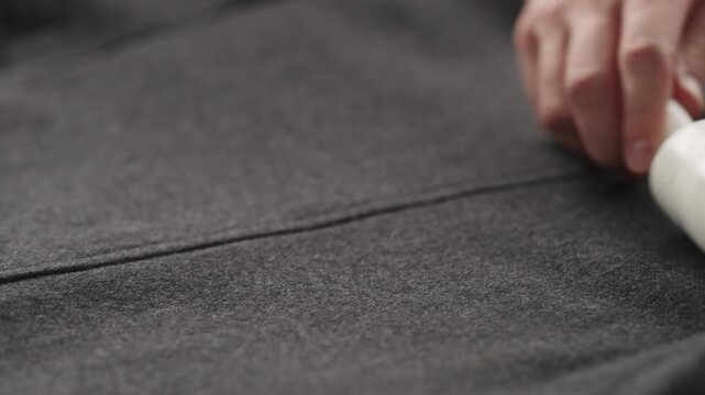 Slow motion cleaning coat with lint roller