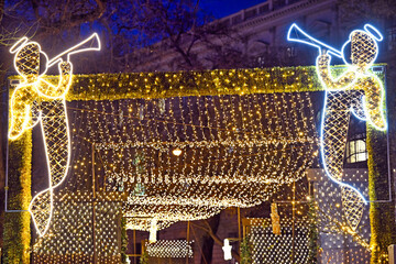 Fototapeta premium Illuminated Christmas Angel Light Installations at Vienna City Hall Square Market