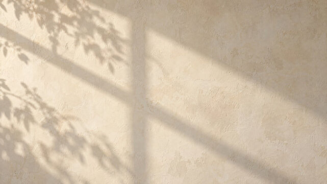 Minimalist beige plaster wall texture with soft window shadow, warm cream stucco background for product mockup, organic leaf shadow overlay