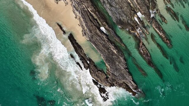 Top down drone footage of surf washing over the rocks at Snapper Rocks, Gold Coast, Queensland Australia