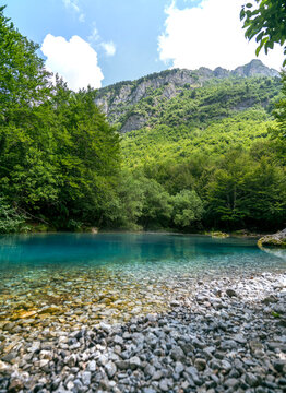 Beautiful karst spring Oko Skakavice The Eye with amazing blue water in Prokletije National Park, Montenegro.
