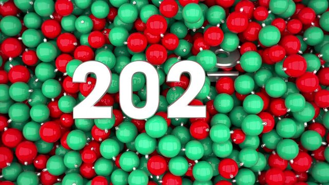 Red and green Christmas ornaments form the year 2026 before revealing 2027 in a festive New Year celebration.