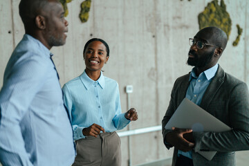 Diverse business professionals having informal discussion in modern office