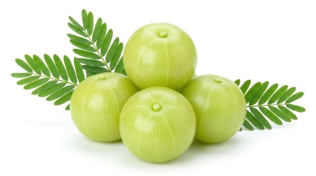 Fresh green amla fruits with green leaves isolated on white background.