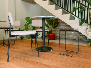 Modern cafe interior with minimalist chairs and tables © Pediatric Visuals