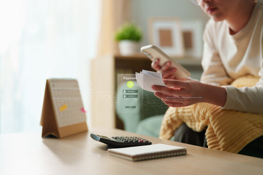 Digital payment, FinTech and personal finance concept featuring smartphone transaction, receipt, calculator, budgeting and payment security at home