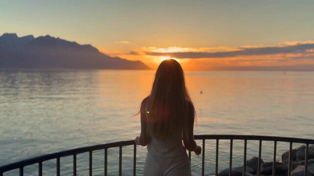 Young Blonde Woman Enjoying Sunset by Lake Geneva in Switzerland
