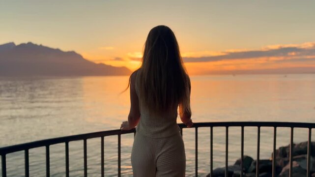 Young Blonde Woman Enjoying Sunset by Lake Geneva in Switzerland