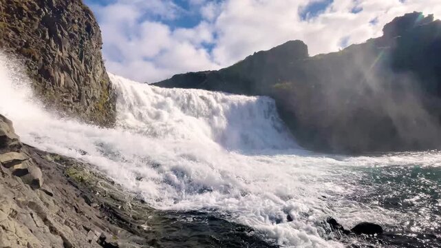 Scenic Double Waterfall Hj&aacute;lparfoss and Basalt Rocks in Iceland