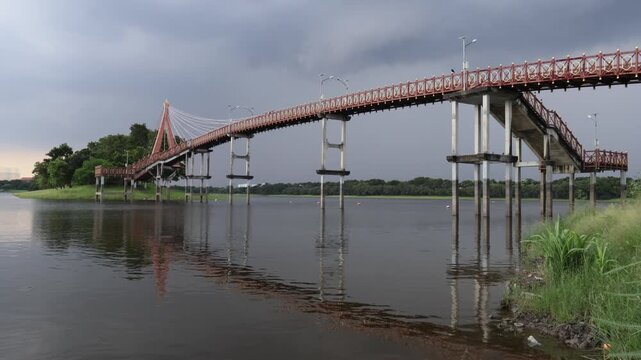 BANGKOK, Oct. 4, 2026: Rain clouds are gathering; water stains on the bridge pillars indicate that the Nong Bon retention basin has the capacity to hold a vast amount of additional water.