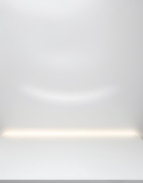 Minimalist studio background with a white curved wall surface and a horizontal strip of warm glowing hidden LED light