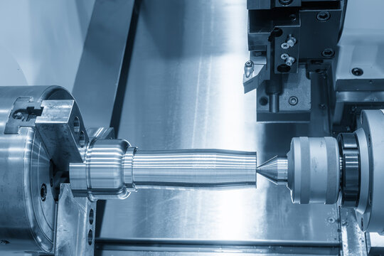High precision metal shaft parts cutting on a CNC lathe machine in a light blue scene