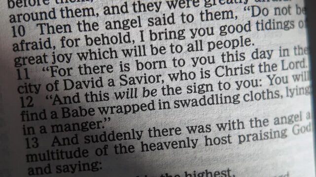 Luke 2 Bible scripture about the birth of Jesus Christ Savior slowly opening page Christian faith Christmas