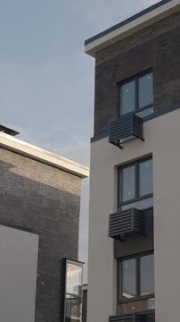 Streetlamp And Structural Elements Evoke Industrial Aesthetic Within Peaceful Neighborhood Setting. Stock Clip