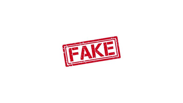 Red fake rubber stamp impression on white background, grunge texture overlay for fact checking and misinformation concepts