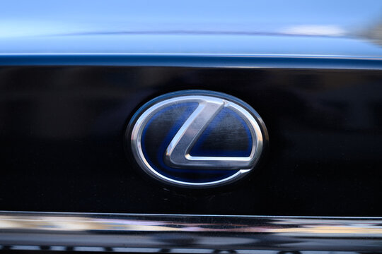 Saint Petersburg, Russia &mdash; September 28, 2026: Close-up of Lexus logo emblem on a black car grille with chrome trim, automotive brand detail.