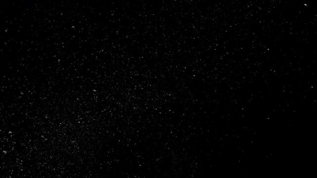 Camera Pulling Back Asteroids And Meteors Flying Through Deep Space