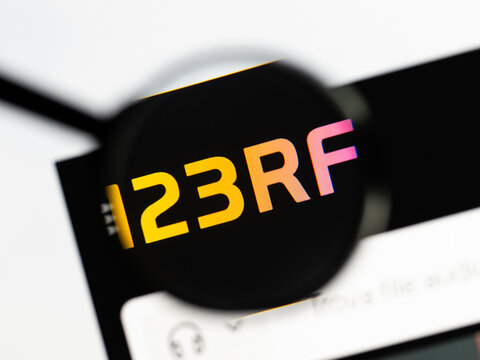 Milan, Italy 2026, 15 AGO Closeup of 123rf com website page on a laptop screen. Focus on 123rf com logo under a magnifying glass.