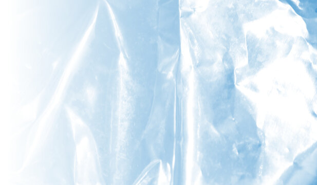 Abstract light blue plastic wrap texture background with glossy shiny overlay and crumpled foil reflection 