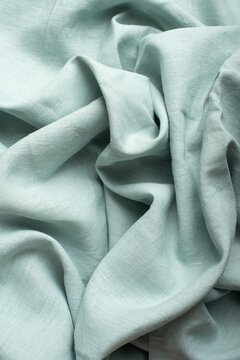 Draped Mint Green Linen Fabric Macro Texture Close Up