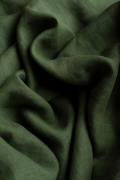 Crumpled Olive Green Linen Fabric Background