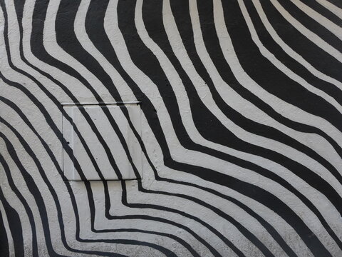 A zebra patterned graffiti mural