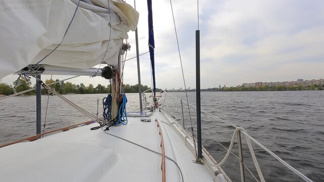 Yacht motoring at calm river