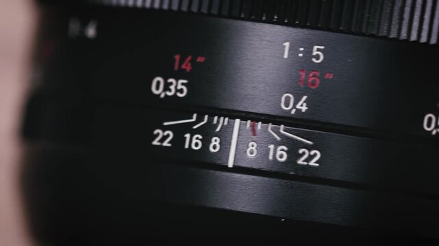 Extreme close up digital camera lens. with sharp glass elements and metal rings. Reflections and warm bokeh lights highlight precision optics, photography technology and modern visual media.