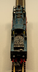 Rear diagonal view of a Z scale steam locomotive with coal tender on track, miniature model train in 1:220 scale © Pascal