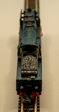 Rear diagonal view of a Z scale steam locomotive with coal tender on track, miniature model train in 1:220 scale