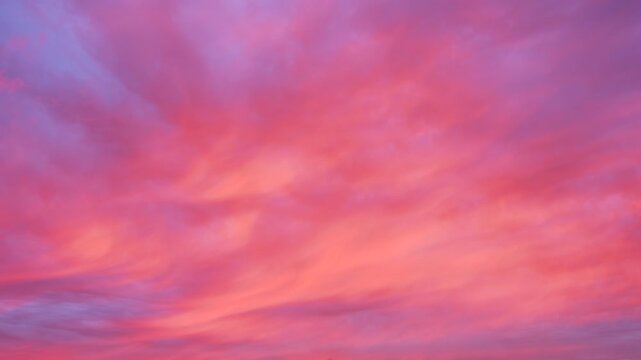Vibrant pink and purple clouds fill  heaven Soft gradients blend into sunset hues. sky appears calm and serene. Perfect for peaceful atmosphere project