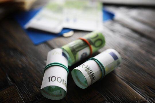 100 euro banknote pack and wood bankground. Currency, financial