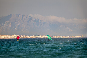 Wing foiling in Valdevaqueros Tarifa with African mountains background © Paolo Corazza