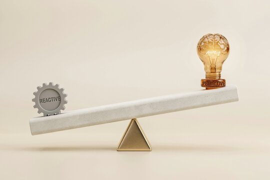 A seesaw balancing a reactive gear against a proactive glowing brain lightbulb on a neutral background.