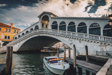 Rialto Bridge over the Grand Canal in Venice, Italy – Famous Historic Landmark and Scenic Venetian Cityscape © lokomotiv48